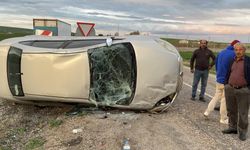 Takla atan otomobilden burnu bile kanamadan kurtuldu